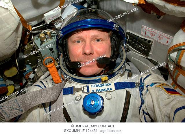 Cosmonaut Gennady Padalka, Expedition 20 commander, attired in a Russian Sokol launch and entry suit, occupies his seat in the Soyuz TMA-14 during final...