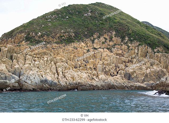 Wave erosion rocks at the coast of Jin Island (Tiu Chung Chau), off Sai Kung, Hong Kong