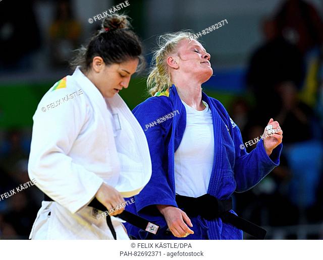 Luise Malzahn of Germany (blue) in action against Mayra Aguiar of Brazil in action during the Women -78 kg Quarterfinal of the Judo events during the Rio 2016...