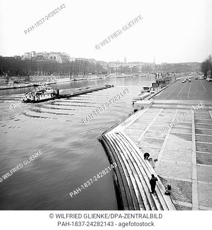 View over the Seine from the Seine islands in Paris, France, in November 1970. The shore is a popular place for locals and tourists. Photo