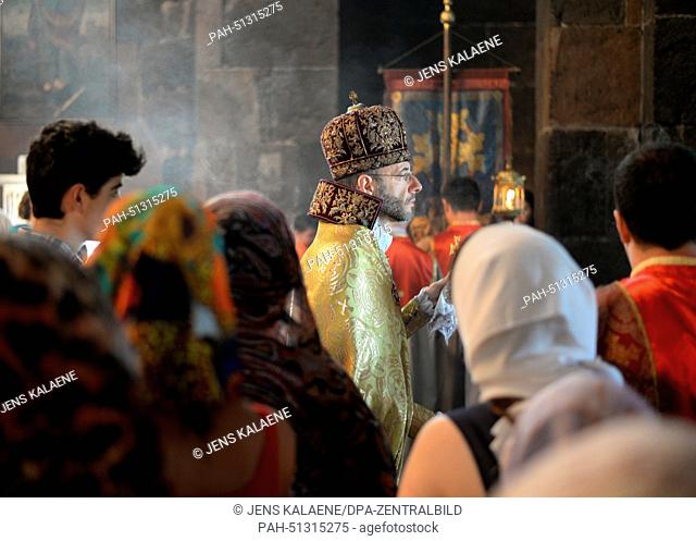 Church attendants take part in a church service of the Armenian apostolic Church of Saint Hripsime in Etschmiadsin, Armenia, 22 June 2014