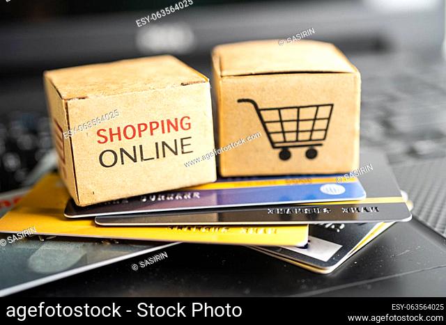 Shopping online box with credit card on laptop computer. Finance commerce import export business concept