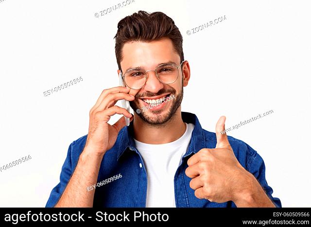 Charming handsome. Handsome young man in casual wear while standing isolated on white background