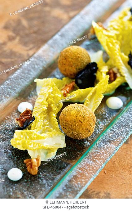 Truffled spring chicken croquets with lettuce hearts and a nut dressing