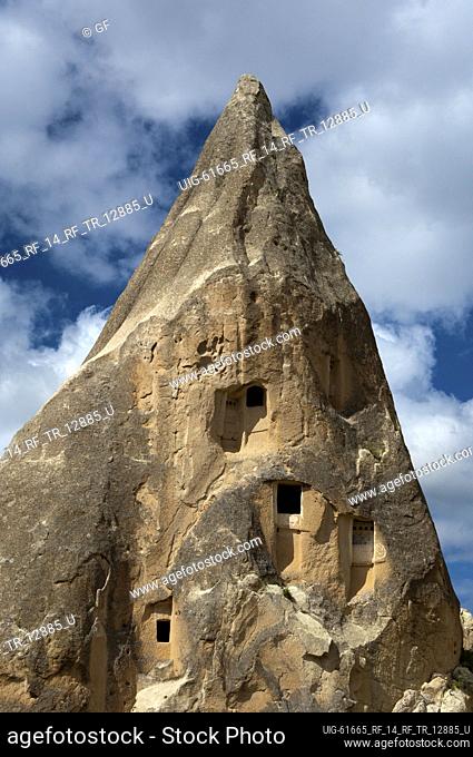 Eroded tuff rock with access openings to storage rooms and dovecotes, Goereme National Park, Cappadocia, Turkey