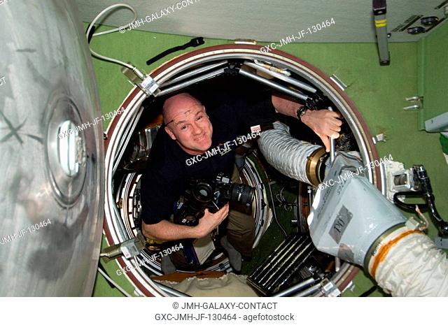 European Space Agency astronaut Andre Kuipers, Expedition 30 flight engineer, is pictured in a hatch on the International Space Station