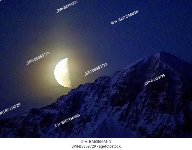 half moon over mount Bentsjordtinden, Norway, Troms, Tromsoe