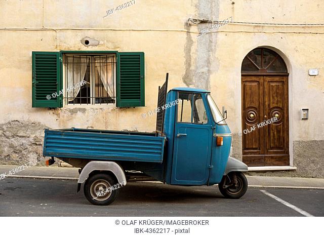 Typical Italian Tricycle Piaggio Ape parked in an alley, Pitigliano, Maremma, district Grosseto, Tuscany, Italy