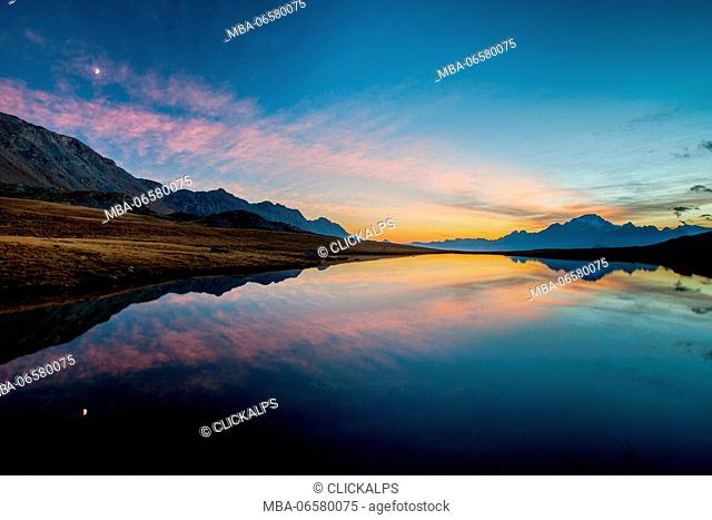 pink sunset in the lake of campagneda, malenco valley, ombardy, italy, europe