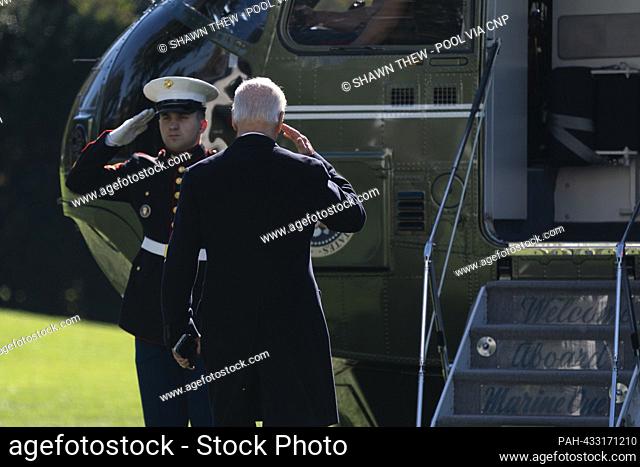 United States President Joe Biden salutes the Marine Guard prior to boarding Marine One on the South Lawn of the White House in Washington, DC, USA