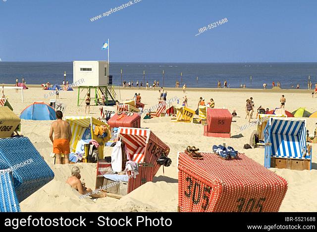 Beach chairs, holidaymakers and lifeguard station at the beach, Langeoog Island, East Frisia, Lower Saxony, Germany, Europe