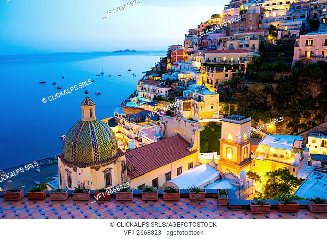 Positano, Amalfi Coast, Campania, Sorrento, Italy. View of the town and the seaside in a summer sunset