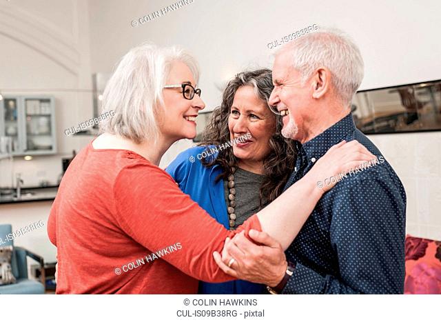 Happy seniors chatting at home