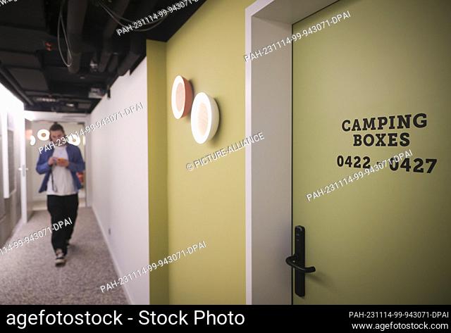 14 November 2023, Hamburg: View of a corridor with so-called ""camping boxes"" (mini hotel rooms/sleeping pods) during a media tour of the new ""Villa Viva...