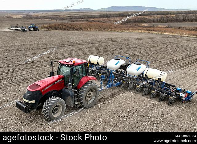 RUSSIA, PRIMORYE REGION - MAY 3, 2023: A sowing machine operates in a field of the Mishin Mikhail Yuryevich farm in the Oktyabrsky District
