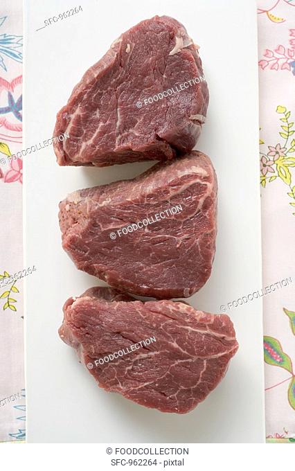 Three slices of beef fillet