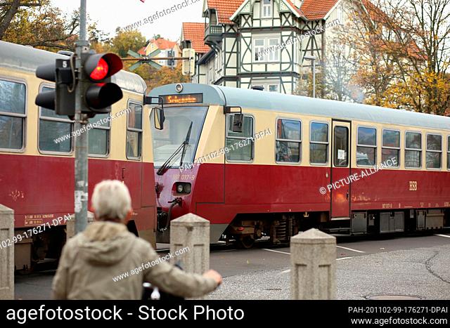 02 November 2020, Saxony-Anhalt, Wernigerode: A railcar of the Harzer Schmalspurbahn GmbH (HSB) runs from Wernigerode to Schierke