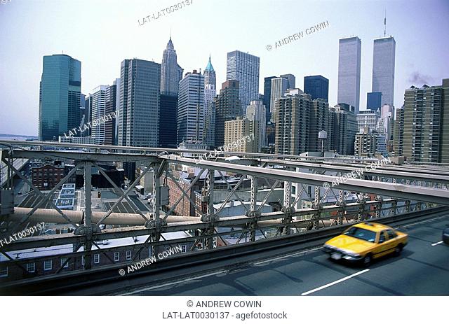 Manhattan. Downtown financial district skyline. View from Brooklyn Bridge. Taxi. Buildings