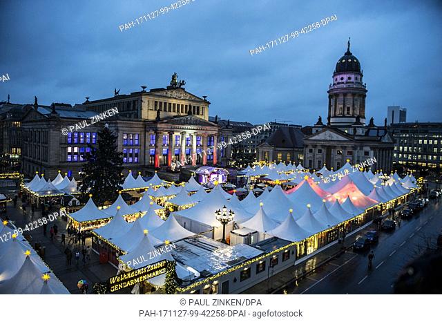 The Gendarmenmarkt Christmas market glows with light in Berlin, Germany, 27 November 2017. The Christmas market in front of the the Konzerthaus in Berlin opened...