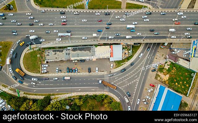 Aerial top view of road junction from above, automobile traffic and jam of many cars