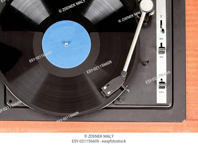 Spinning vinyl record. Motion blur image. Vintage toned