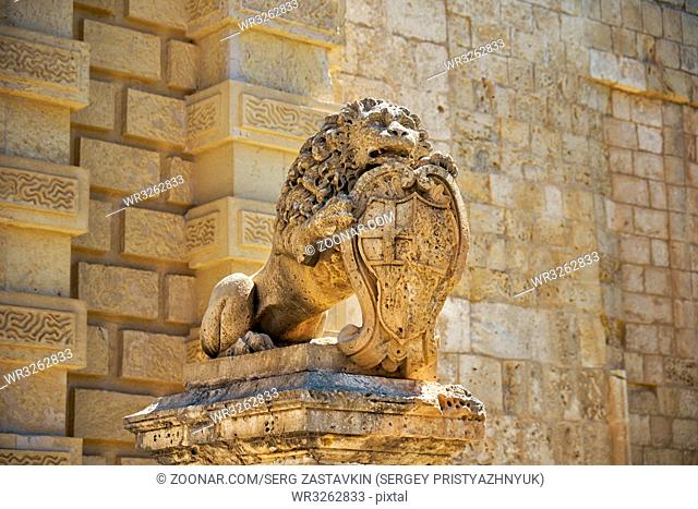 Statue of lion holding shield with the coats of arms of Antonio de Vilhena near Mdina Main Gate. Malta