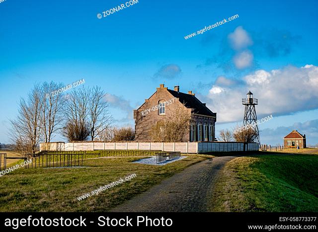 The former island Schokland. The Netherlands with beautiful spring clouds and a blue sky, The former island of Schokland was the first UNESCO World Heritage...
