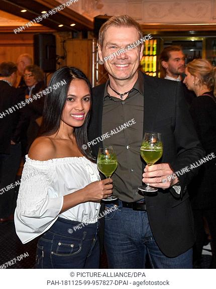 25 November 2018, Bavaria, München: Sven Unterwaldt, director and his girlfriend Aila come to the aftershow party after the film premiere of ""Tabaluga - Der...