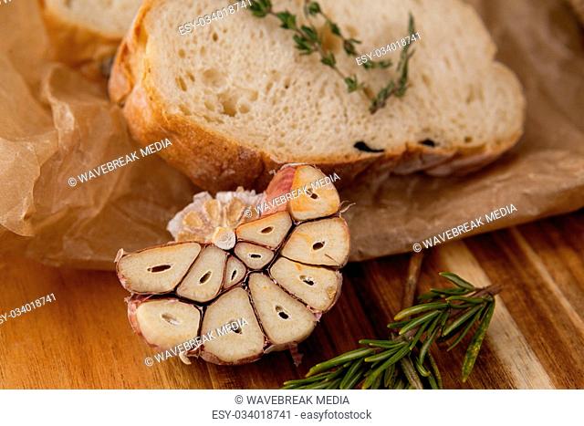 Food with herb and bread on table