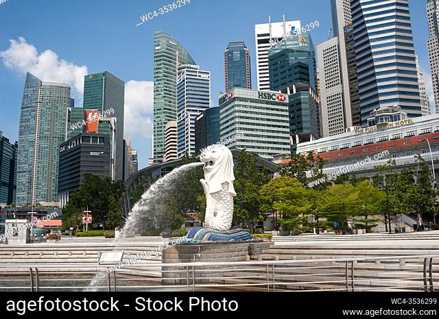 Singapore, Republic of Singapore, Asia - Abandoned Merlion Park with fountain along the banks of the Singapore River and skyscrapers of the central business...