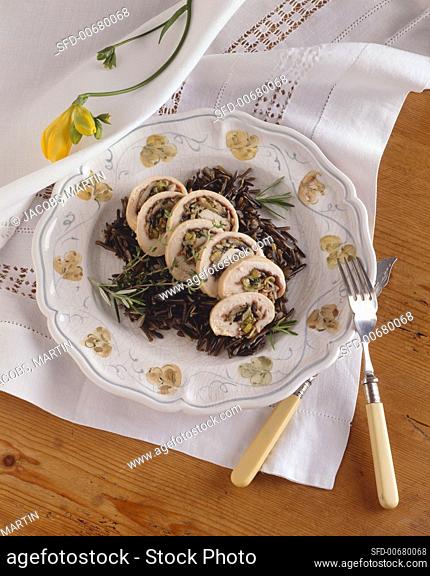 Prosciutto and Leek Rolled Chicken Sliced Over Wild Rice