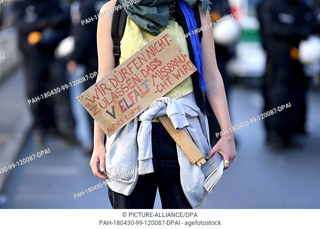 30 April 2018, Germany, Berlin: A participant of a demonstration carries a sign reading 'Wir duerfen nicht zulassen, dass Vielfalt missbraucht wird - Audre...