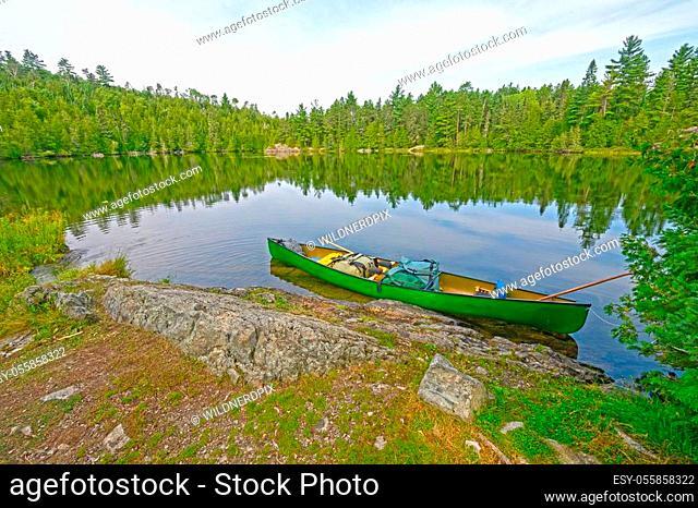Canoe on the Wilderness Shore of Ottertrack Lake in the Boudnary Waters of Minnesota