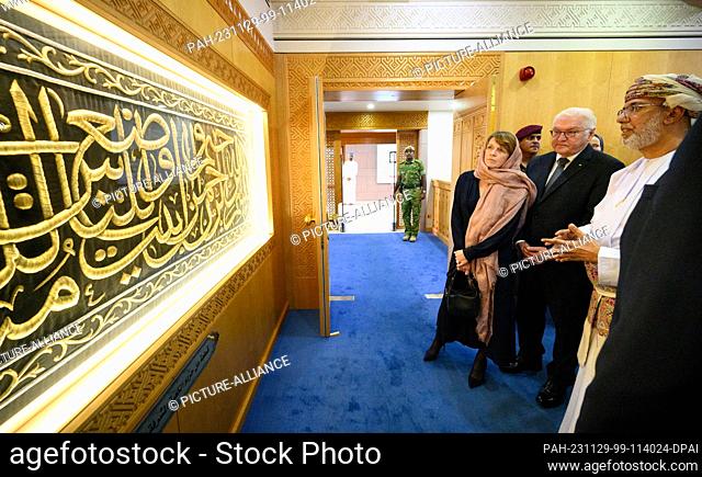 29 November 2023, Oman, Maskat: Federal President Frank-Walter Steinmeier (M) and his wife Elke Büdenbender are guided through the Sultan Qabus Grand Mosque and...