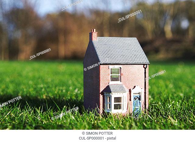 Model of house sits on lawn