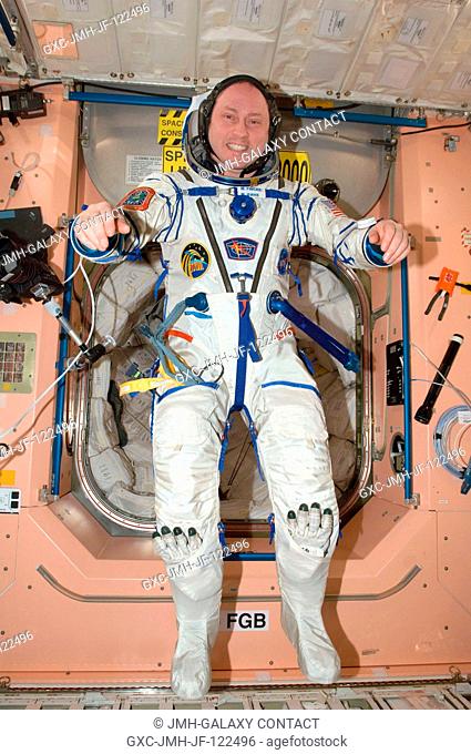 NASA astronaut Michael Fincke, Expedition 18 commander, attired in his Russian Sokol flight suit, poses for a photo in the Unity node of the International Space...