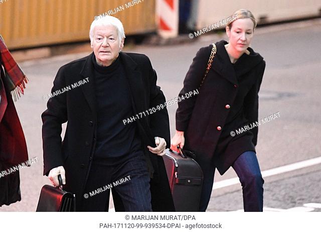 The former owner of the chain of chemist shops Schlecker, Anton Schlecker (L), and his daughter Meike arrive at the regional court in Stuttgart, Germany