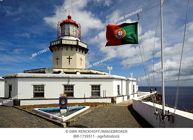 Lighthouse Farol do Arnel on the east coast of the island of Sao Miguel, Azores, Portugal