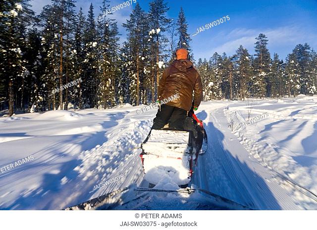 Man on snow mobile, Jokkmokk, Norrbotten, Northen Sweden
