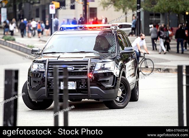 Canada, British Columbia, Vancouver, street scene with police car