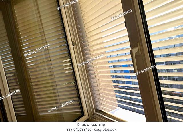 to protect against heat and sun, shutters are attached to a window