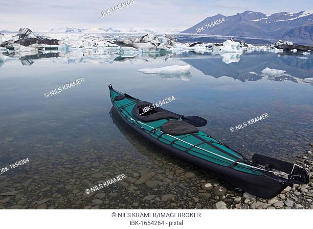 Folding kayak on the bank of the Joekulsarlon glacial lake, Iceland, Europe