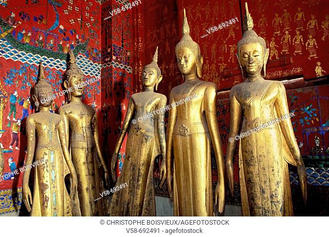Golden Buddhas in the calling for rain posture at Wat Xieng Thong temple, Luang Prabang. Laos