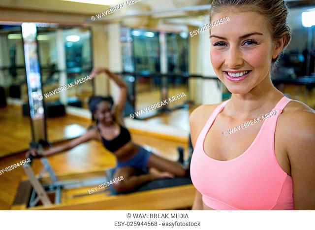 Portrait of fit woman in fitness studio