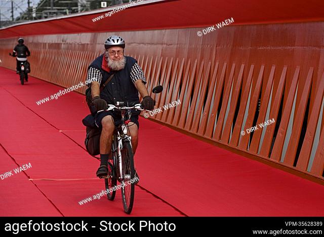A cyclist pictured during a press moment of De Werkvennootschap, on the occasion of the official opening of the first bicycle and pedestrian bridge over the...