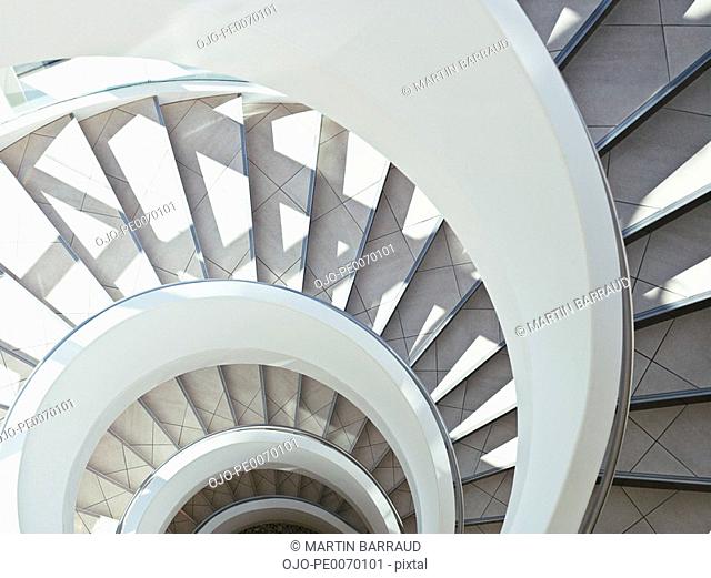 Directly above modern, spiral staircase