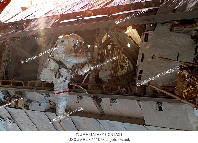 Astronaut Daniel Tani, Expedition 16 flight engineer, participates in the second of five scheduled sessions of extravehicular activity (EVA) as construction...