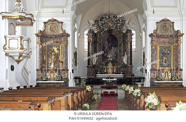 Flowers decorate the central nave and the altar in the church of Saint Joseph prior to the wedding of Maria Theresia von Thurn and Taxis and Hugo Wilson in...