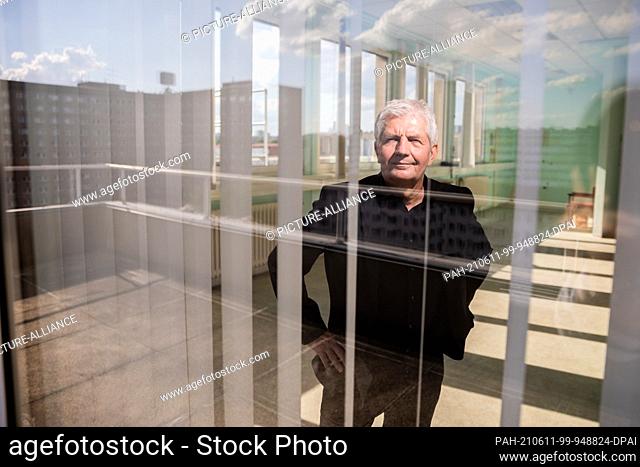 09 June 2021, Berlin: Roland Jahn, outgoing head of the Stasi documentation authority, looks through a window of ""House 7