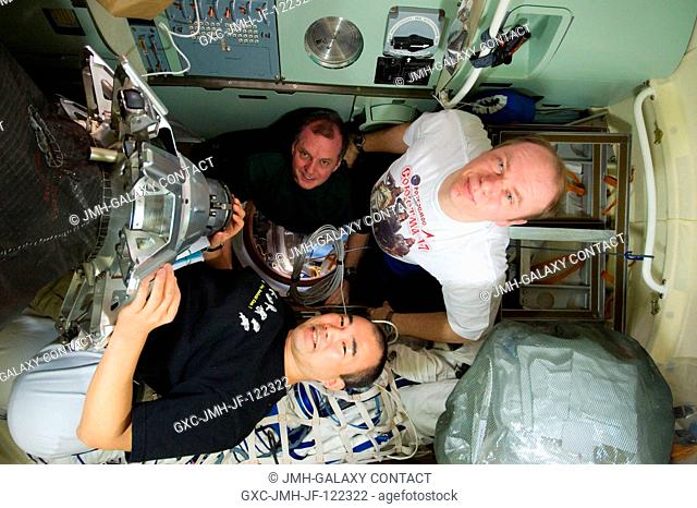Russian cosmonaut Oleg Kotov (right), Expedition 23 commander; Japan Aerospace Exploration Agency (JAXA) astronaut Soichi Noguchi (bottom) and NASA astronaut T